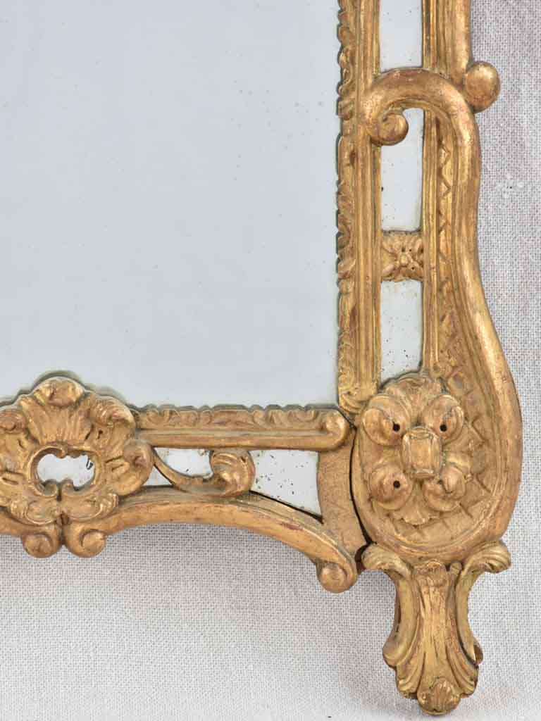 Small 19th century French mirror - gilded w/ bouquet pediment - 24¾" x 13¾"