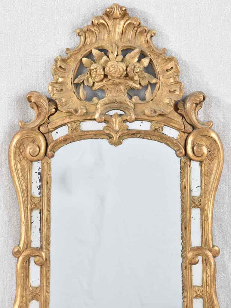 Small 19th century French mirror - gilded w/ bouquet pediment - 24¾" x 13¾"