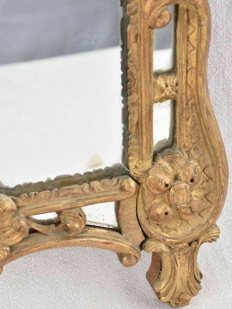 Small 19th century French mirror - gilded w/ bouquet pediment - 24¾" x 13¾"