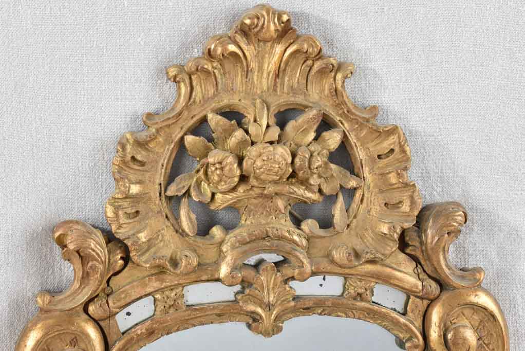 Small 19th century French mirror - gilded w/ bouquet pediment - 24¾" x 13¾"