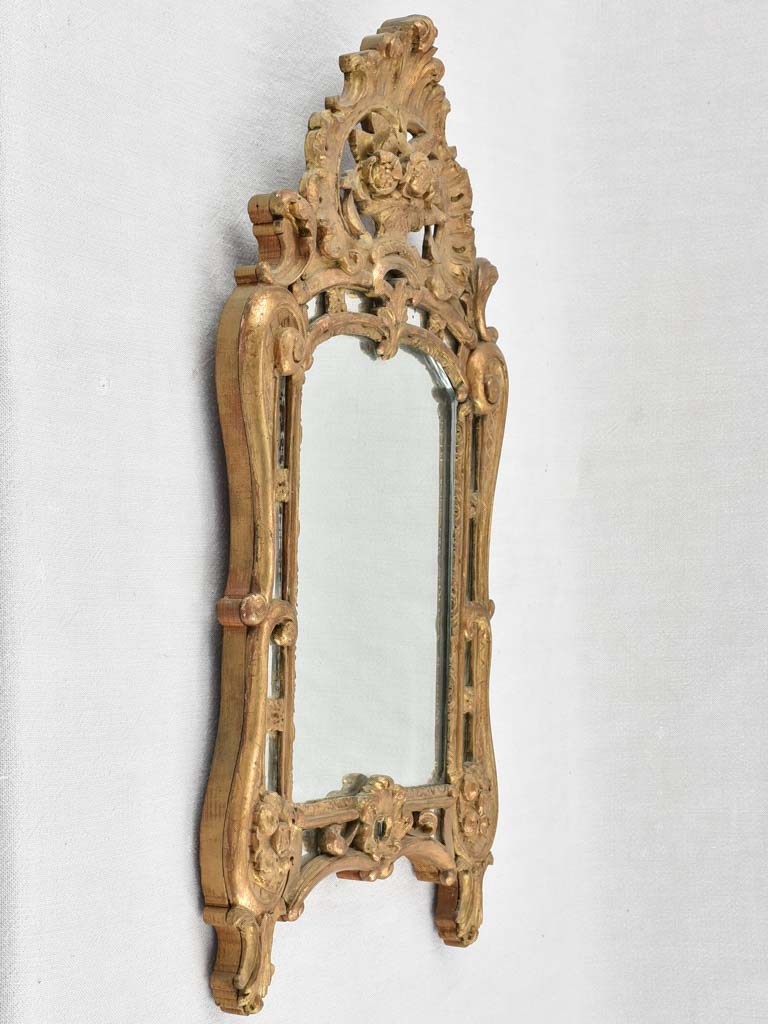 Small 19th century French mirror - gilded w/ bouquet pediment - 24¾" x 13¾"