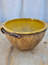 Large antique terracotta bowl with yellow glaze