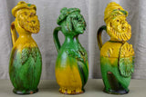 Three antique folk art pitchers with yellow and green glaze