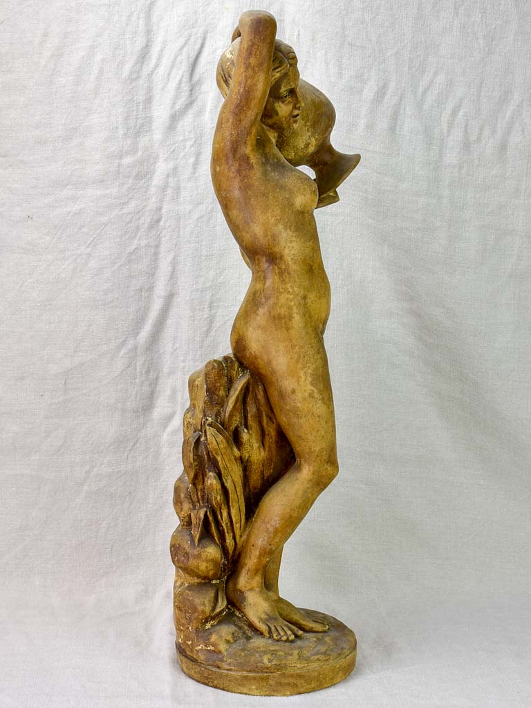 Antique terracotta sculpture of a woman holding a vase 29½"