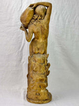Antique terracotta sculpture of a woman holding a vase 29½"