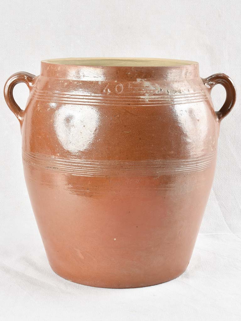 Very large antique crock pot with brown glaze
