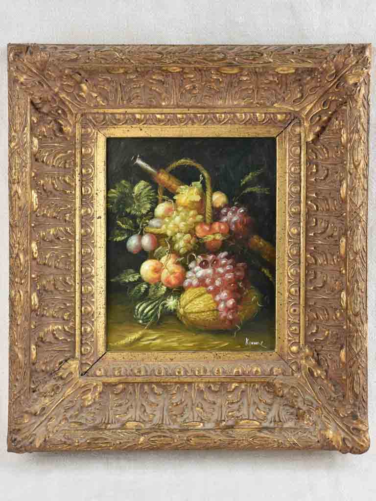 Antique, opulent gilded frame with Kyomie