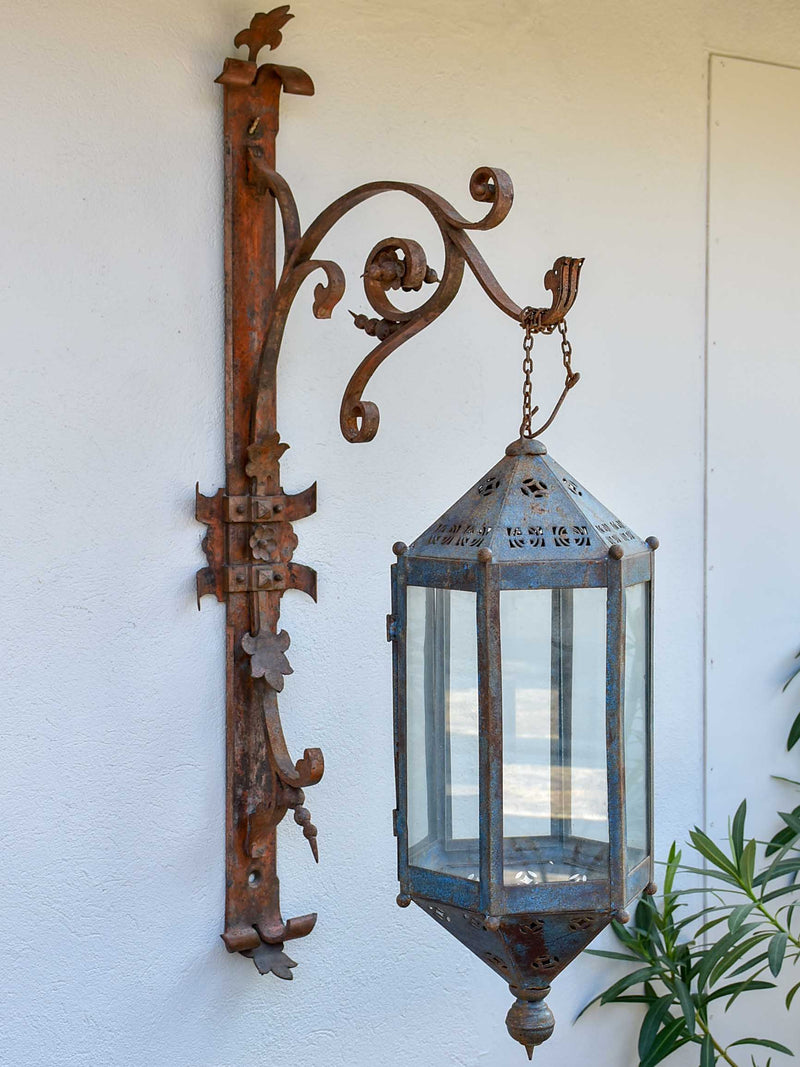 Antique lantern with large wrought iron wall bracket