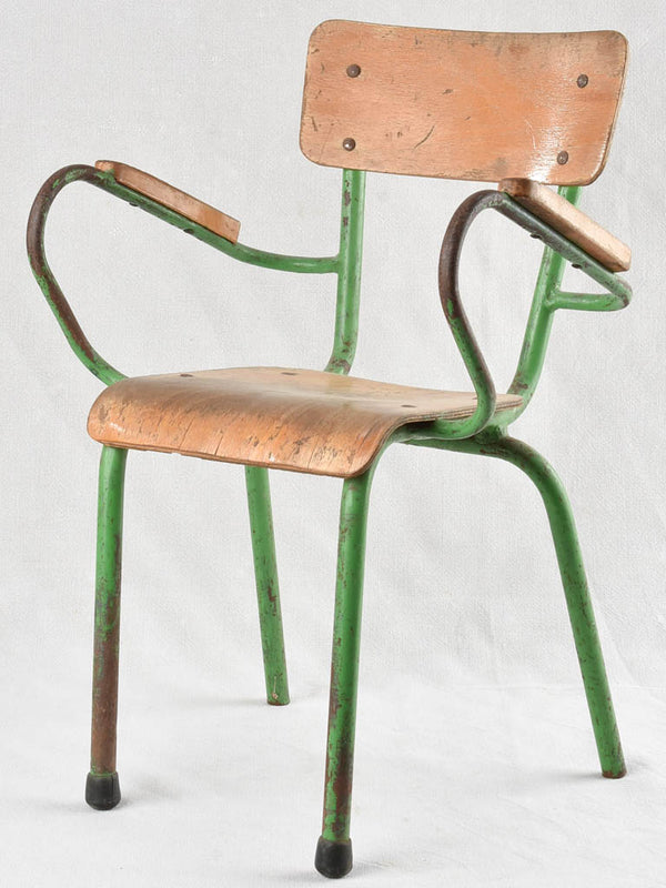 Vintage children's armchair with green patina