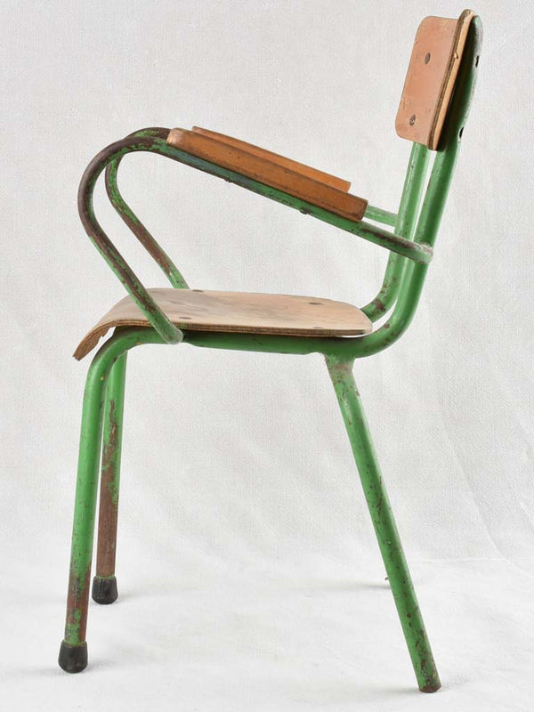Vintage children's armchair with green patina