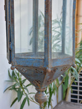 Antique lantern with large wrought iron wall bracket