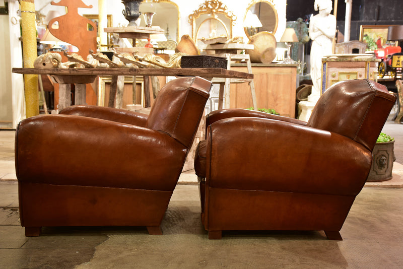 Pair of large moustache back French leather club chairs