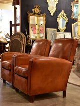 Pair of vintage French leather club chairs with square backs