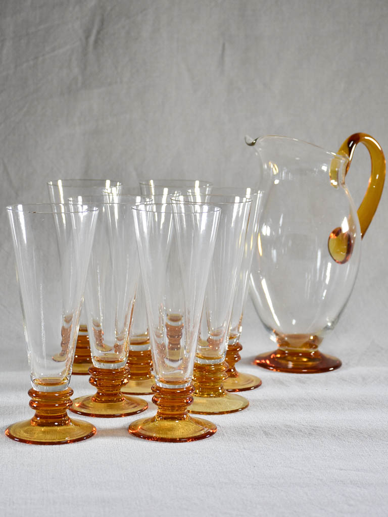 Set of eight tumblers with matching pitcher - clear and amber glass