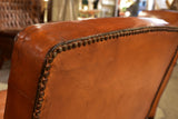 Pair of vintage French leather club chairs with square backs