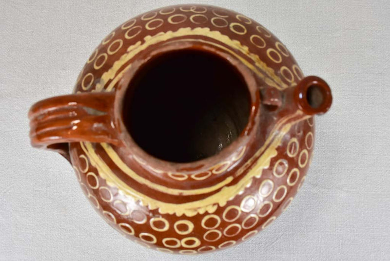 Late 19th century French water pitcher with brown glaze and beige spots