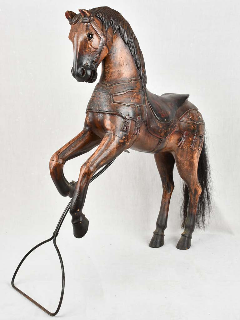 Antique wooden carousel horse with stand