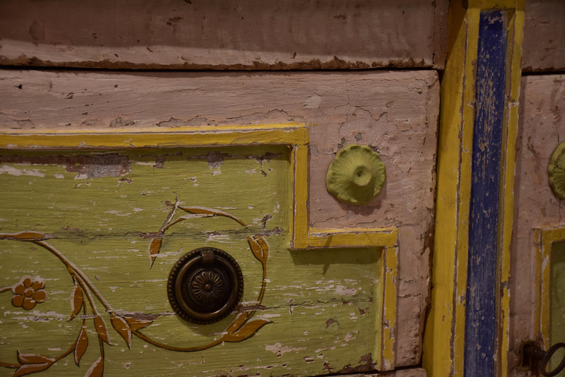 Demilune commode with pink, green, yellow and blue patina
