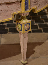 Demilune commode with pink, green, yellow and blue patina