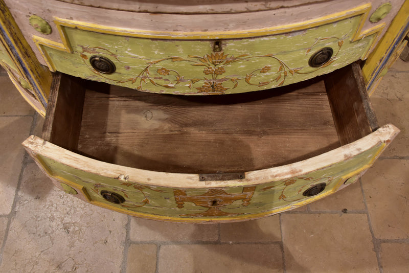 Demilune commode with pink, green, yellow and blue patina