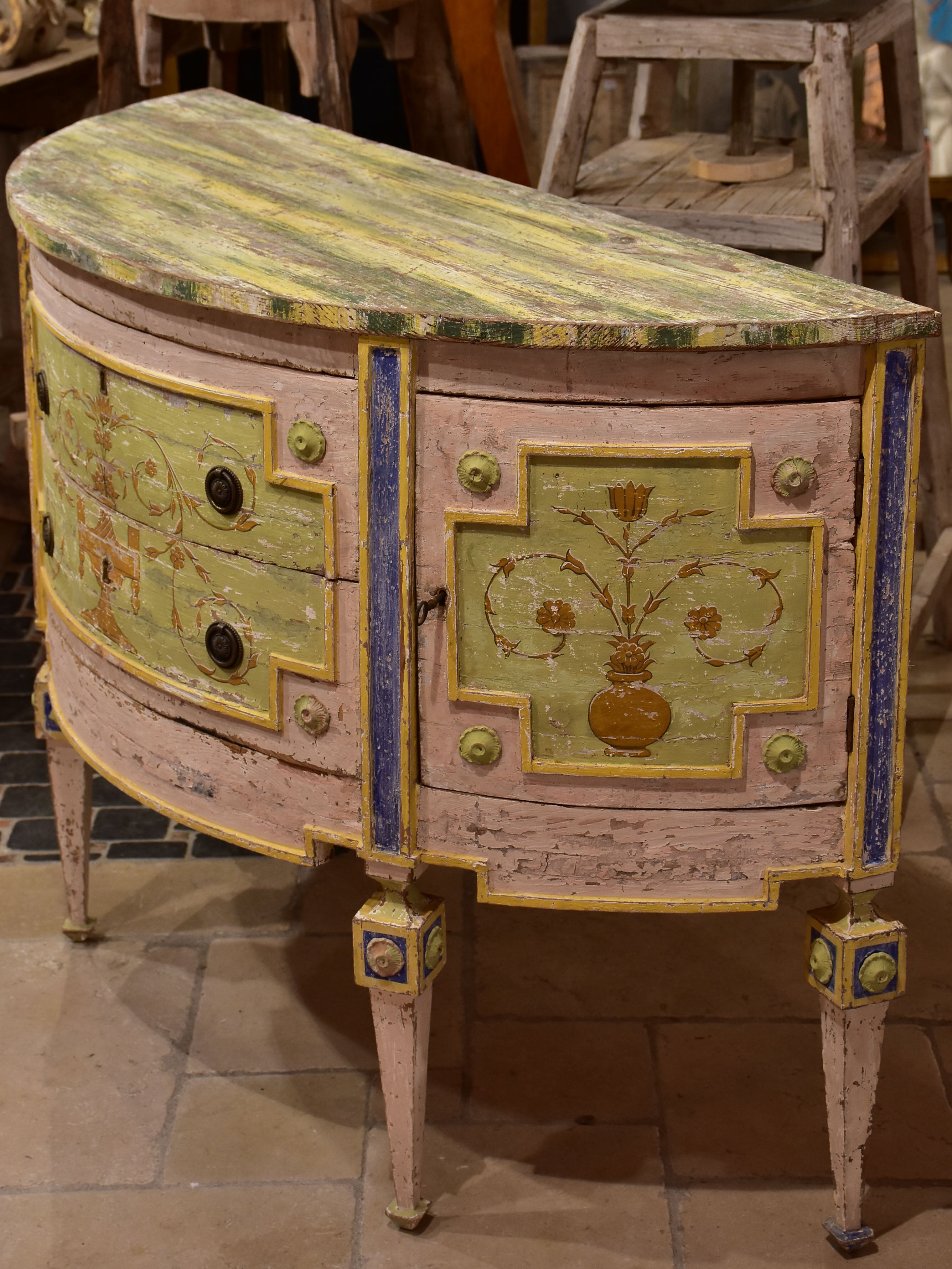 Demilune commode with pink, green, yellow and blue patina