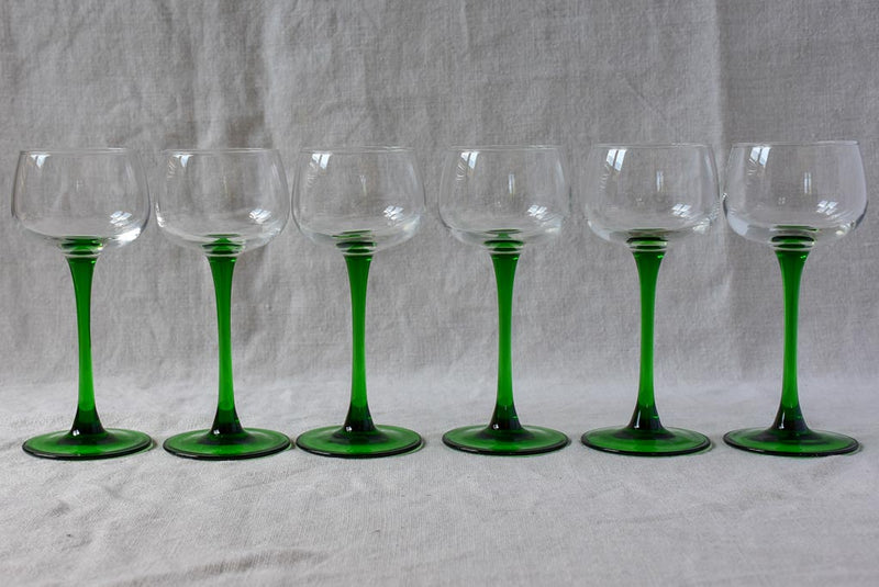 Six vintage Alsatian wine glasses with green stems