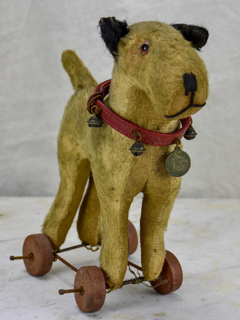 Antique French toy dog on wheels