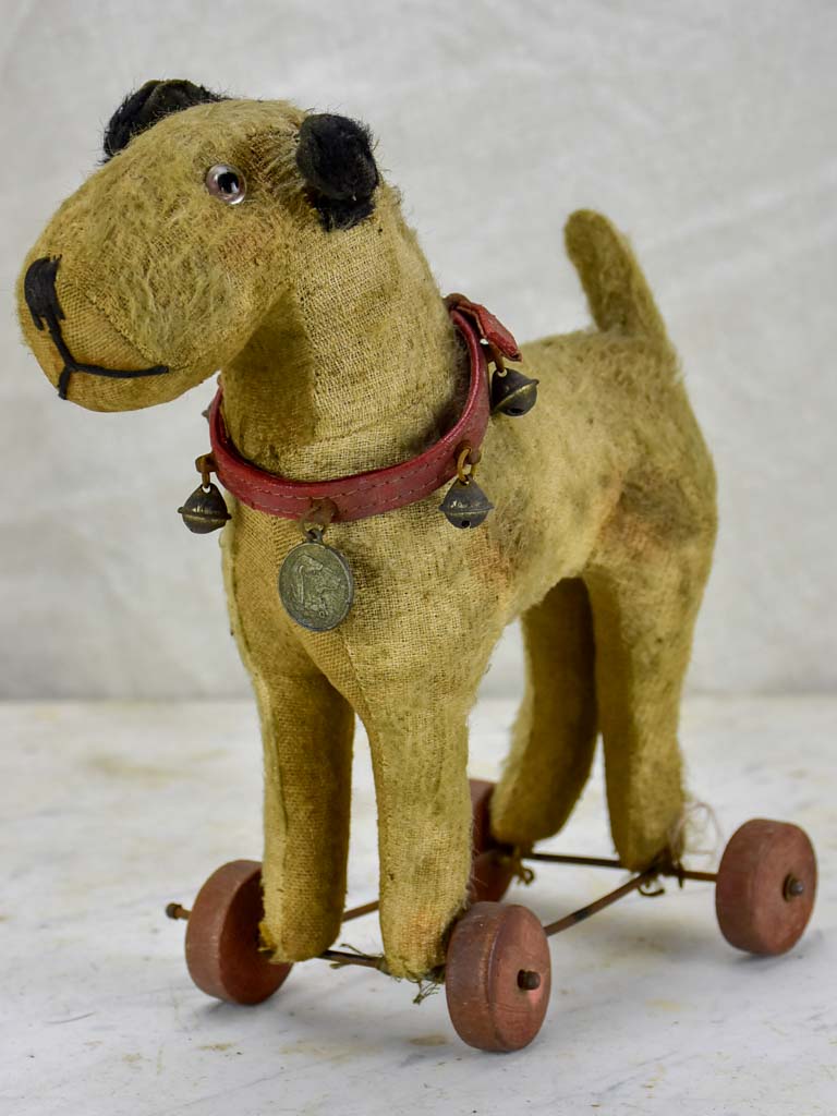 Antique French toy dog on wheels