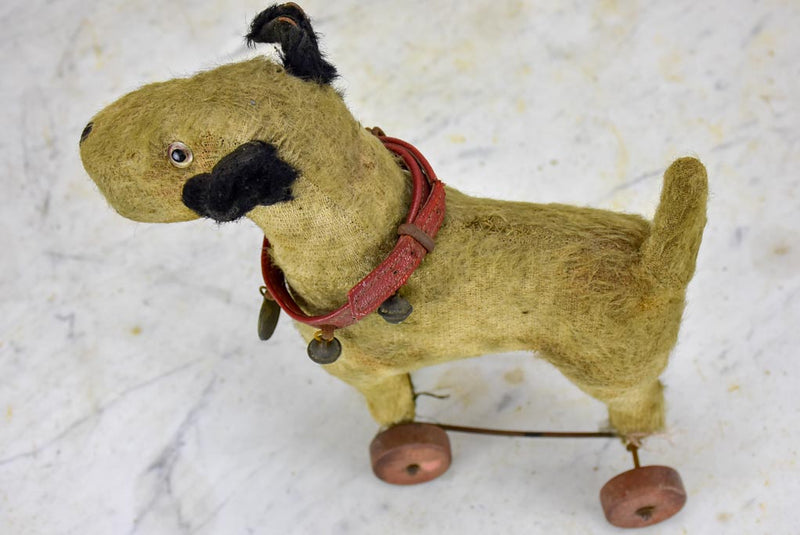 Antique French toy dog on wheels