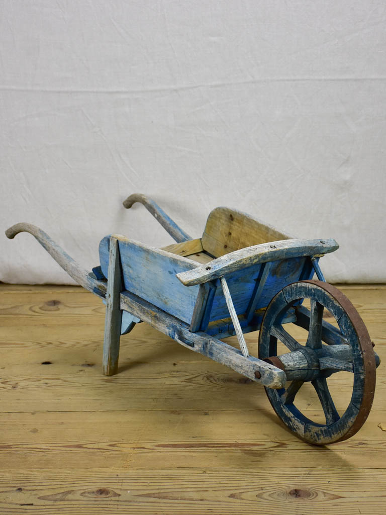 Early 20th Century French children's wheelbarrow with blue patina