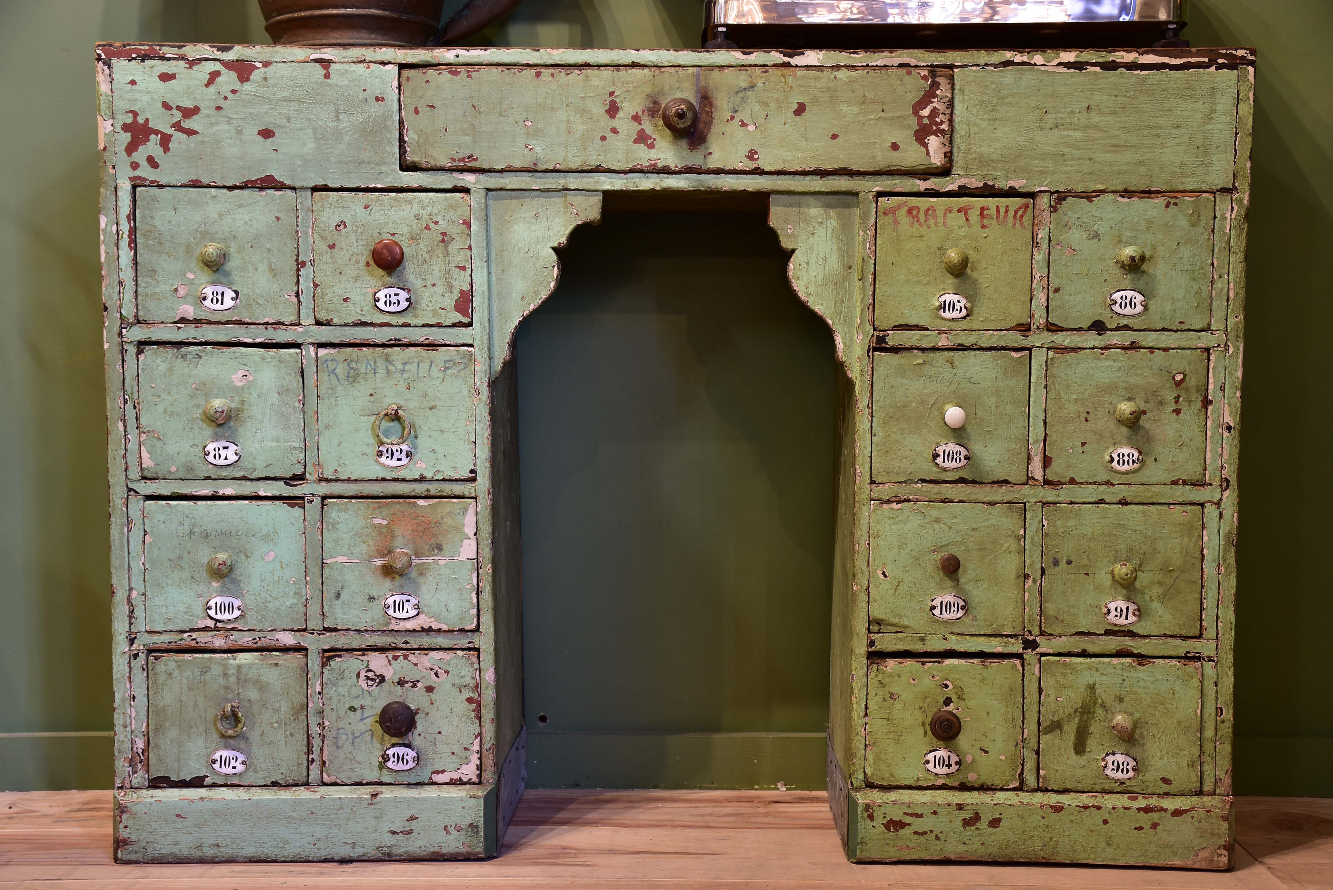 Set of small merchant's drawers with green patina