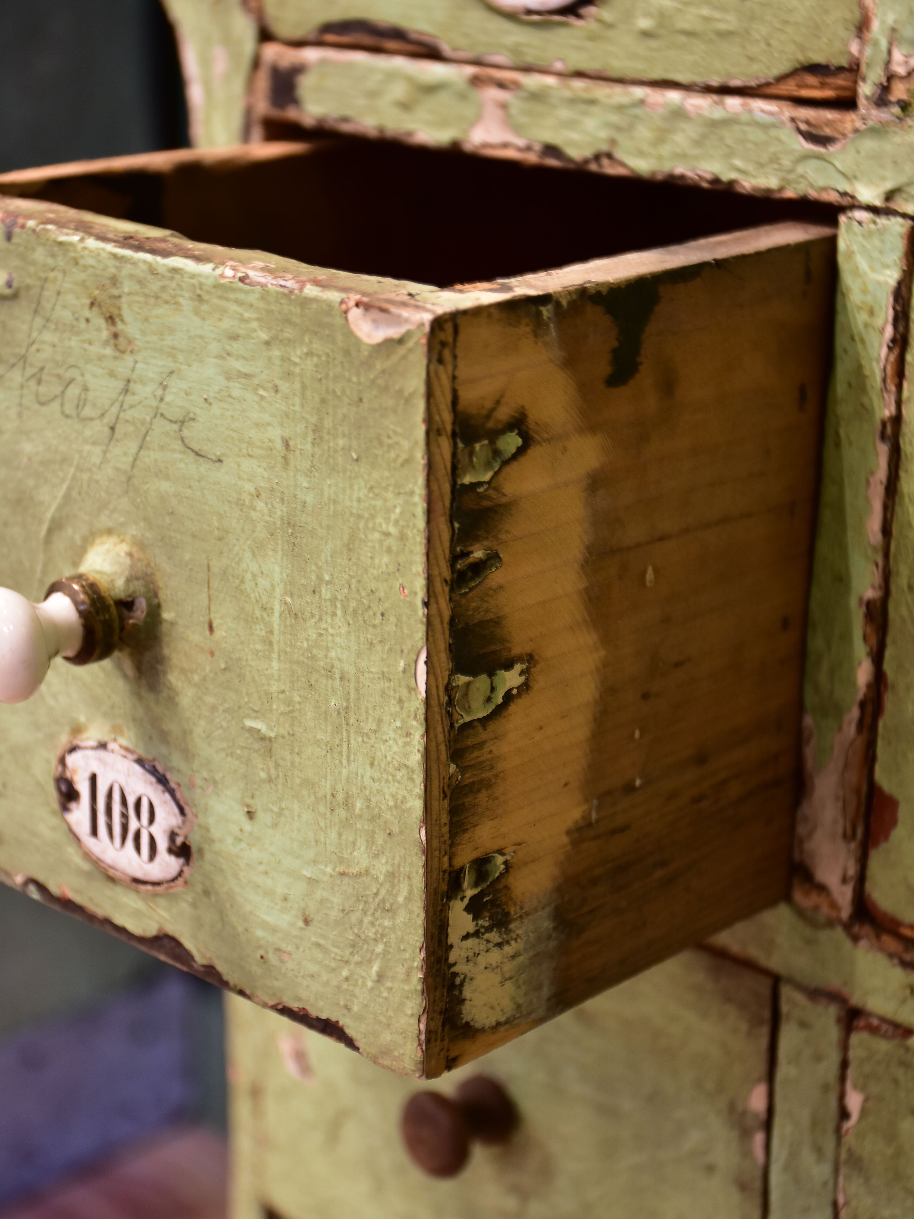 Set of small merchant's drawers with green patina