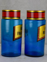 Two blue glass antique French apothecary jars with lids