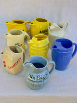 Collection of eight 1930's Pastis water pitchers