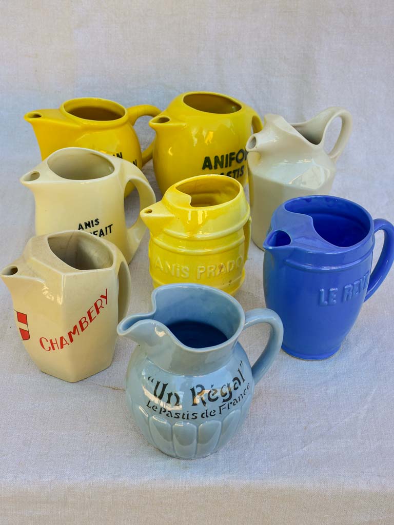 Collection of eight 1930's Pastis water pitchers