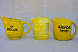 Collection of eight 1930's Pastis water pitchers