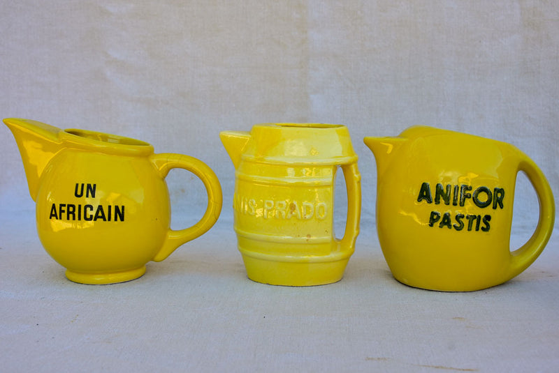 Collection of eight 1930's Pastis water pitchers