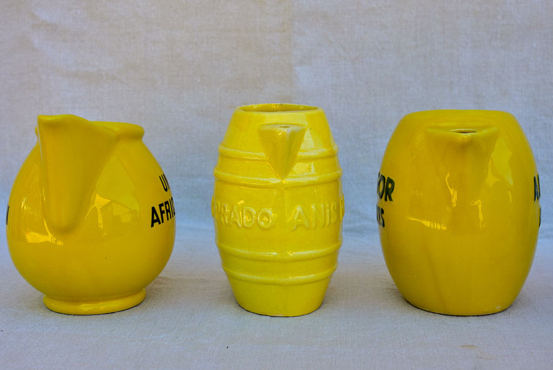 Collection of eight 1930's Pastis water pitchers