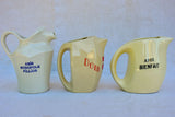 Collection of eight 1930's Pastis water pitchers
