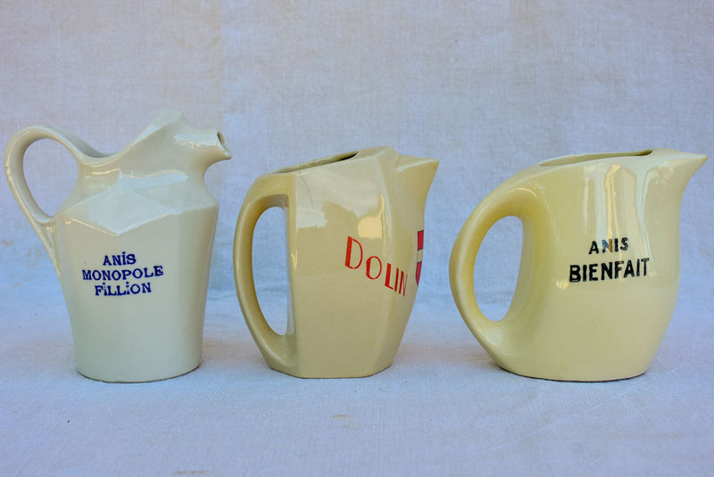 Collection of eight 1930's Pastis water pitchers
