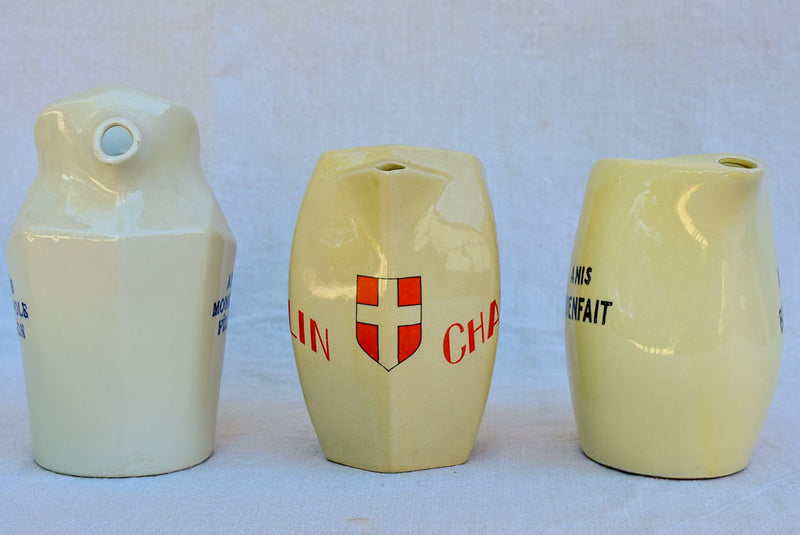 Collection of eight 1930's Pastis water pitchers