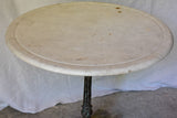 Late 19th Century round French table with marble top and cast iron base 31"