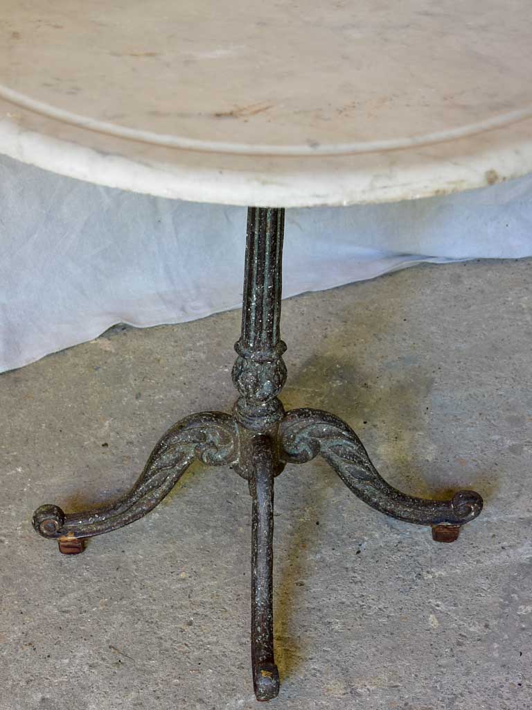 Late 19th Century round French table with marble top and cast iron base 31"