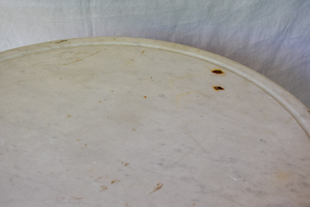 Late 19th Century round French table with marble top and cast iron base 31"