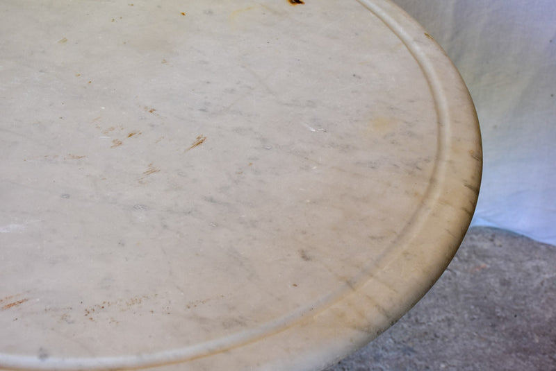 Late 19th Century round French table with marble top and cast iron base 31"