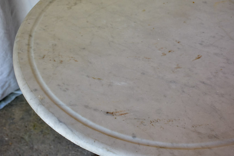 Late 19th Century round French table with marble top and cast iron base 31"