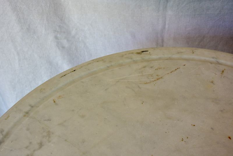 Late 19th Century round French table with marble top and cast iron base 31"