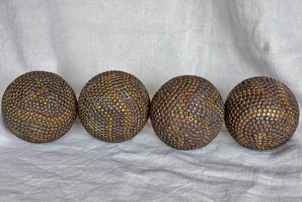 Four antique French petanque balls
