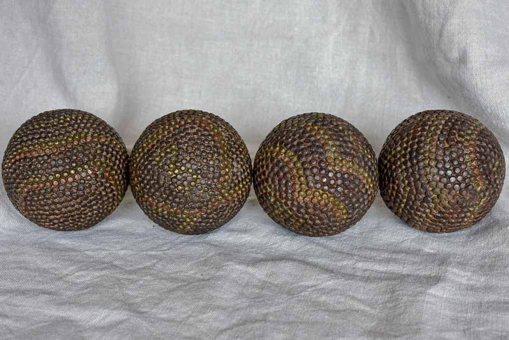 Four antique French petanque balls