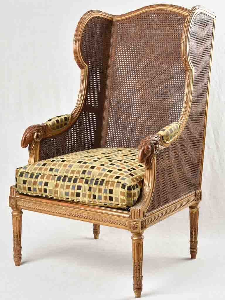 Large cane bergere armchair - ram's heads - 19th century